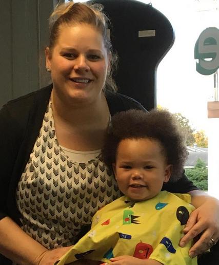 Stylist and young client before a haircut